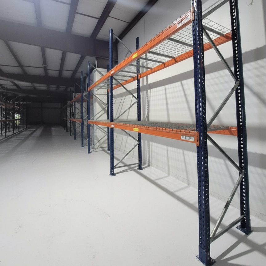 Row of Pallet Racking with standard waterfall wire mesh decks for the shelves
