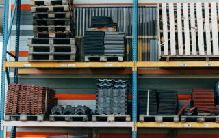 stock of construction equipment on a rack outside